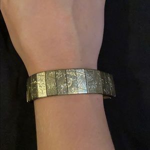 Antique silver flower clasp on bracelet